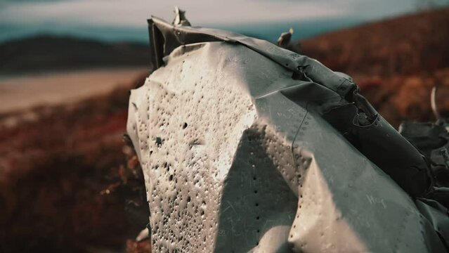T-33 wreckage. Plane wreck in Kangerlussuaq. medium closeup. Panning right.
