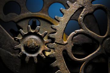 Metal gear sprockets in well used machine, old and rusted closeup still life with beautiful textures and shape. Fine art