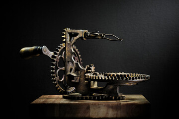 Metal potato peeler gears and  sprockets in machine, old and rusted closeup still life with beautiful textures and shape. Fine art