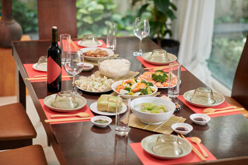 Dinner table served and decorated for Tet celebration, Vietnamese cuisine concept
