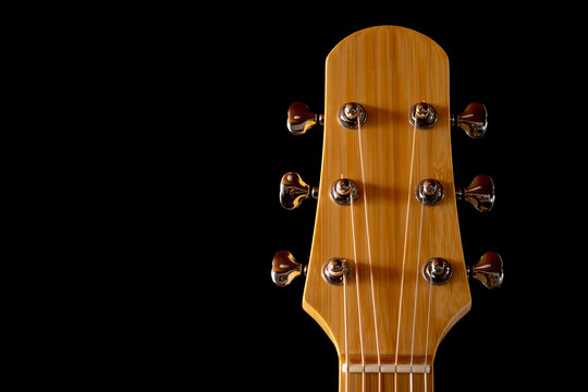 guitar headstock made from bamboo isolated on Black Background