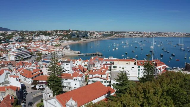 Boats Floating On The Cascais Bay With Panorama Of Cascais Town From Igreja Paroquial de Nossa Senhora da Assuncao In Portugal. - aerial
