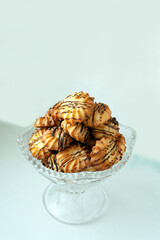 shortbread cookies lie in a crystal vase