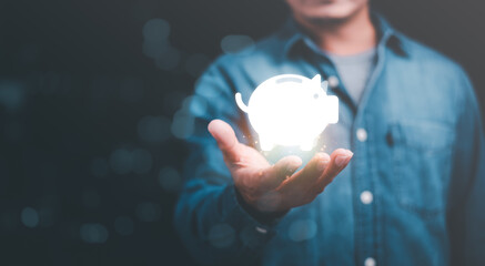 man showing piggy bank icon,Concept of saving money for the future,investment profit...