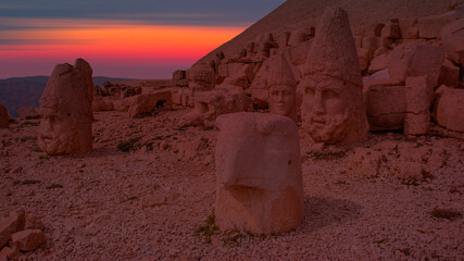Statues God on top of the Nemrut Mountain with amazing sunset - Adiyaman, Turkey