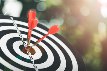 dart arrow hitting in the target center of dartboard,Business targeting and focus concept,the...