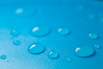 water drops on a blue background .Fluid texture in cold blue tones.Wallpaper blau phone.macro drops set