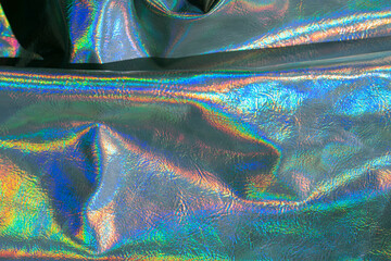 Holographic background. metal holographic wallpaper. texture with iridescent waves and...