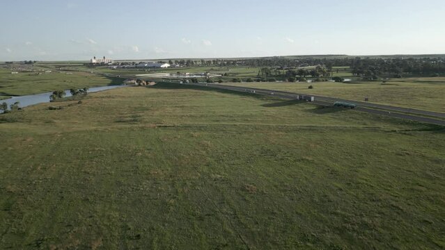 Rotating aerial tracks highway traffic at Vaal River in Villiers, ZA