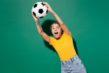 Young goalkeeper overjoyed happy fun woman fan wearing basic yellow t-shirt cheer up support...