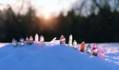 quartz minerals on snow, abstract winter background. Different Gemstones for esoteric Crystal...