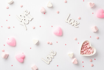 St Valentine's Day concept. Top view photo of inscriptions love heart shaped saucer with sprinkles...