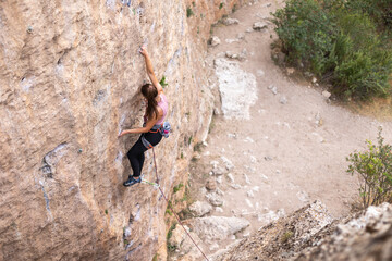 girl rock climber. sport climbing.