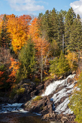 Waterfall and trees with fall colors at Montagne d'argent. Quebec. Canada.