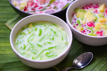Thai dessert - Thai rice flour pandan leaf with coconut milk and syrup sweets dessert on white bowl, Asian food