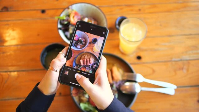 Young Food Blogger Woman Taking Photo Using Mobile Phone of Delicious Japanese Vegan Dishes High Quality 4K Lifestyle and Travel Concept Footage