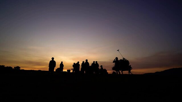 Silhouette of a movie crew in early morning 