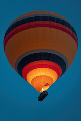 Fototapeta premium hot air balloon in the blue sky at sunrise