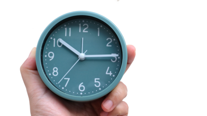 woman hand holding a green alarm clock on blur background.