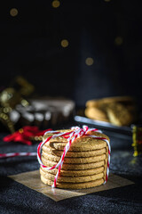 a stack of cookies tied with a Christmas ribbon