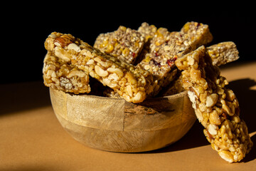 Homemade Granola energy bar. Variety of homemade protein granola breakfast bars with nuts, raisins...