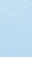 Beautiful snowfall christmas background. Subtle flying snow flakes and stars on light blue winter backdrop. Beautiful snowfall overlay template. Vertical vector illustration.
