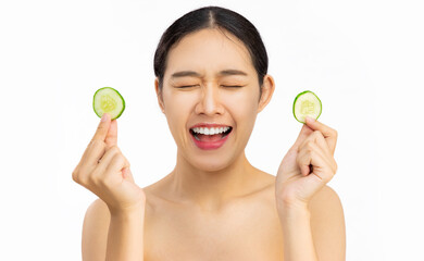 Happy smiling girl using cucumber for Healthy beauty treatment and self skin care lifestyle concept white background.