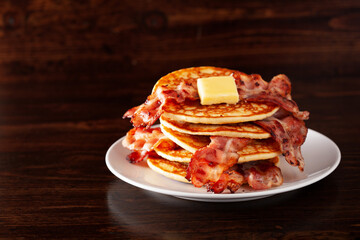 sweet pancakes with butter and bacon. traditional american breakfast