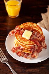 sweet pancakes with butter and bacon. traditional american breakfast