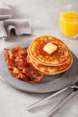 sweet pancakes with butter and bacon. traditional american breakfast
