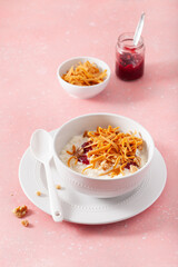 rice pudding with Norwegian brunost traditional brown cheese and raspberry jam