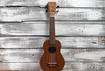 ukulele on a wooden background
