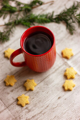 red cup with tea and cookies on the table, close-up. winter holidays, Christmas, New Year