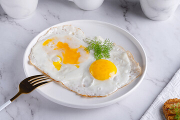 Two fried eggs for healthy breakfast