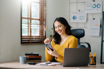 Working woman concept a female manager attending video conference and holding tablet, smatrphone and  cup of coffee