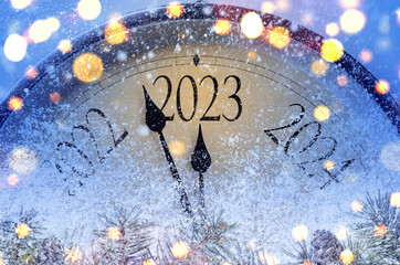 Countdown to midnight. Retro style clock counting last moments before Christmas or New Year 2023