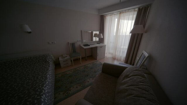 An empty hotel room of economy class.