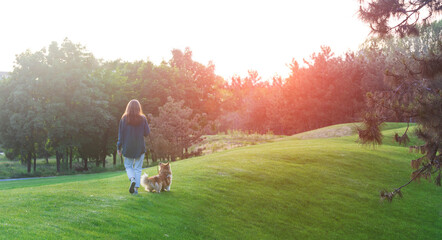 girl and dog walking