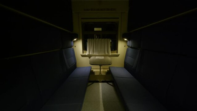 Empty train compartment car in the evening.