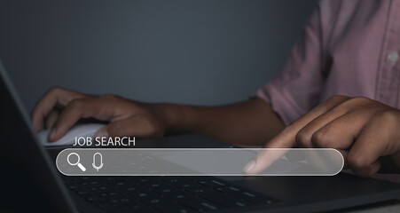 Man browsing work opportunities online by laptop computer. Job search.