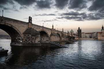 Fototapeta premium Low-Angle View of Charles Bridge and Gun Powder Tower from Lesser Town Bridge Tower, Prague