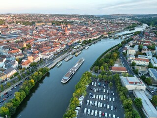 Fototapeta premium River Main Wuzburg city Germany sunset golden hour drone aerial view ..