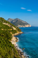 vertical landscape view of the rugged mountainous green east coast of Sardinia