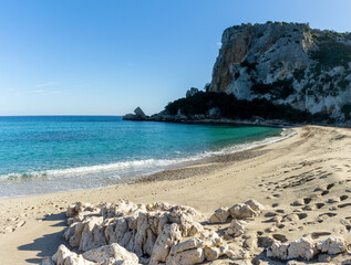 Fototapeta na wymiar cliffs and sandy beach at Cala Luna on the east coast of Sardinia