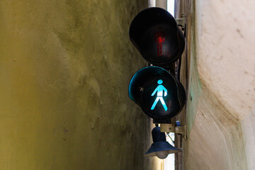 The narrowest pedestrian street in Prague with traffic lights and one-way traffic. Background