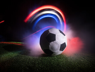 Soccer 2022. Grand Final Argentina vs France theme. Soccer ball on green grass. Support your country or cheer concept.