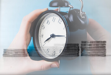 alarm clock on the background of the Russian flag and coins.