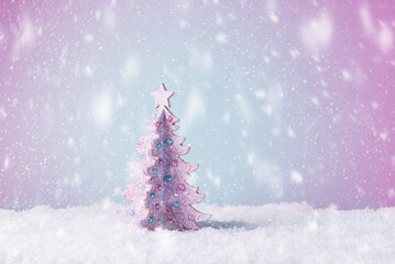 New Year greeting card with Christmas tree in snow. Xmas background with copy space. Merry Christmas and Happy New Year greeting concept