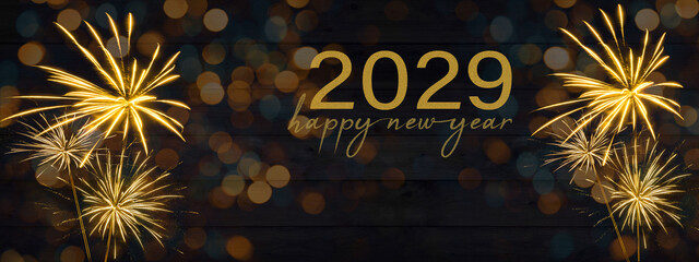 Sylvester, New Year's Eve, Happy new Year 2029 Party, Firework celebration background banner - Golden fireworks and bokeh lights on black wooden wall texture in the night - obrazy, fototapety, plakaty