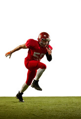 Fototapeta na wymiar Professional american football player in sports uniform and protective helmet in action isolated over white background. Sport, team, competition, bowl